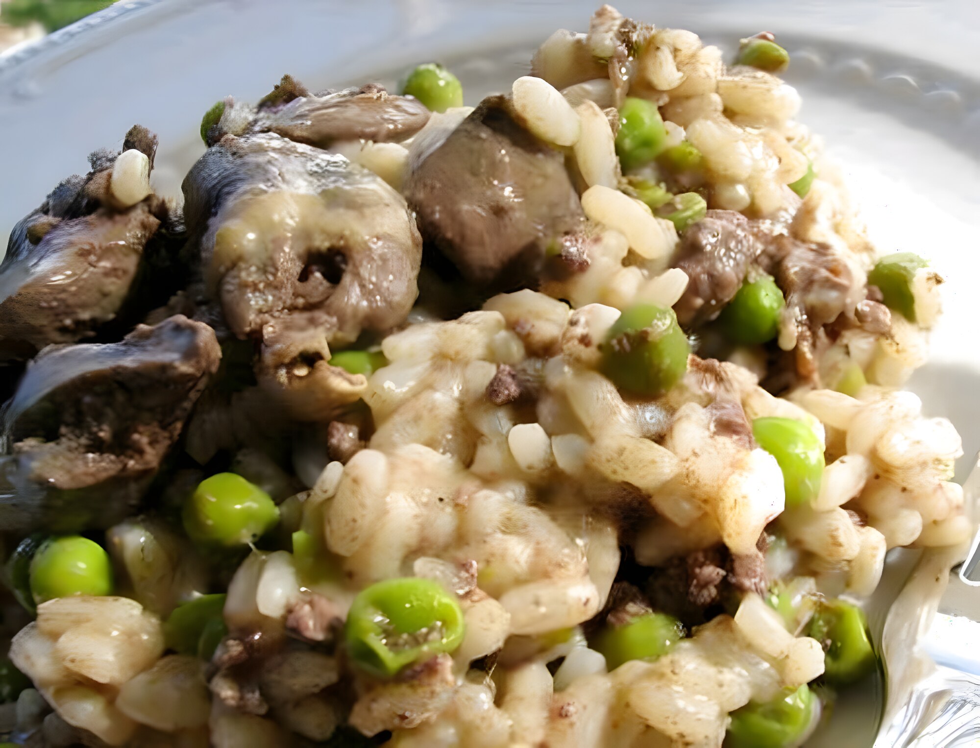 Risotto con Fegatini e Piselli